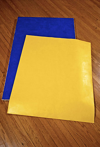 Yellow paper dropped on Blue canvas